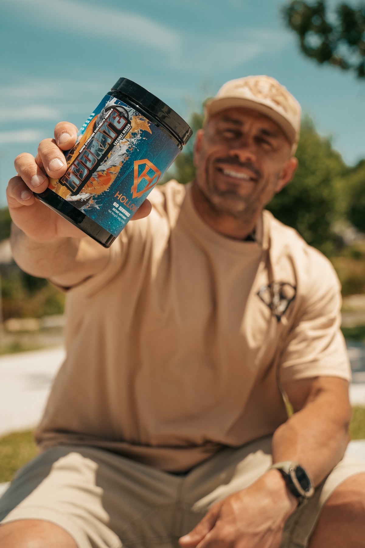 Hollow Labs founder Allen Collins holding Hydrate outdoors