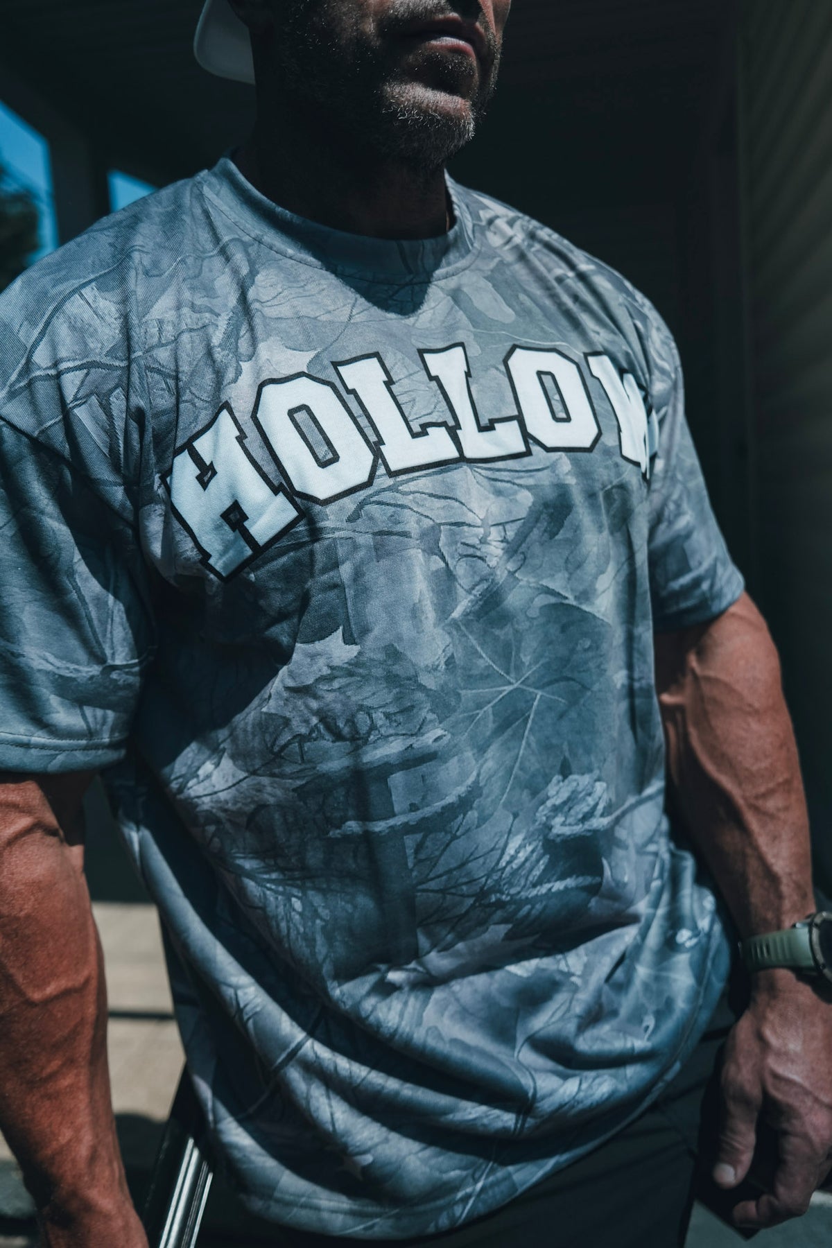 Hollow woodland camo tee with white collegiate HOLLOW chest lettering